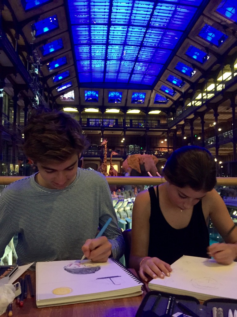 Emerson and Sophie drawing at the museum.